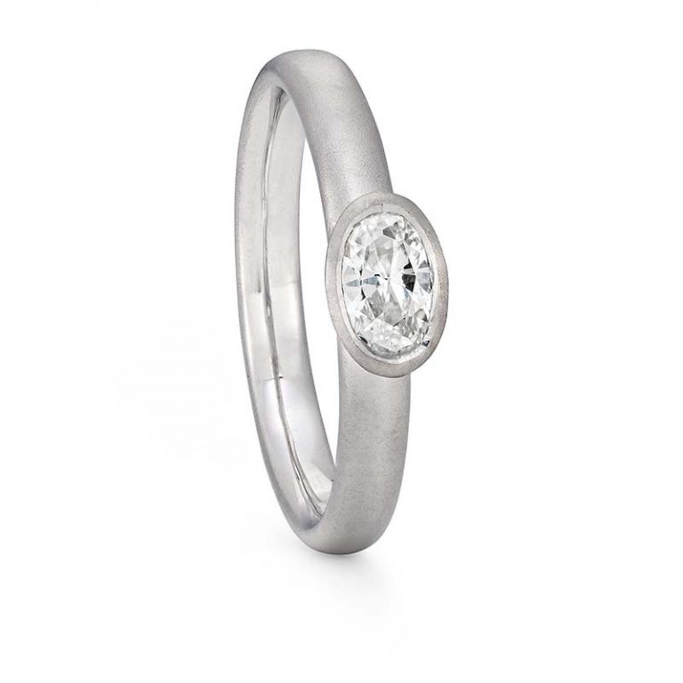 Oval diamond ring handmade in platinum. Set with half carat oval diamond in one of Jacks Turners contemporary engagement ring designs. Handmade in the South west - Bristol
