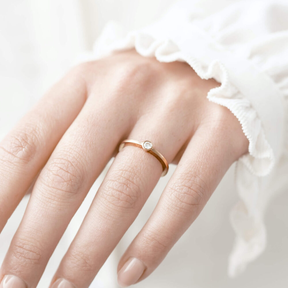 Thin Rose Gold Diamond Engagement Ring On Model. Designed By Jacks Turner In Her Bristol Jewellery Workshop.