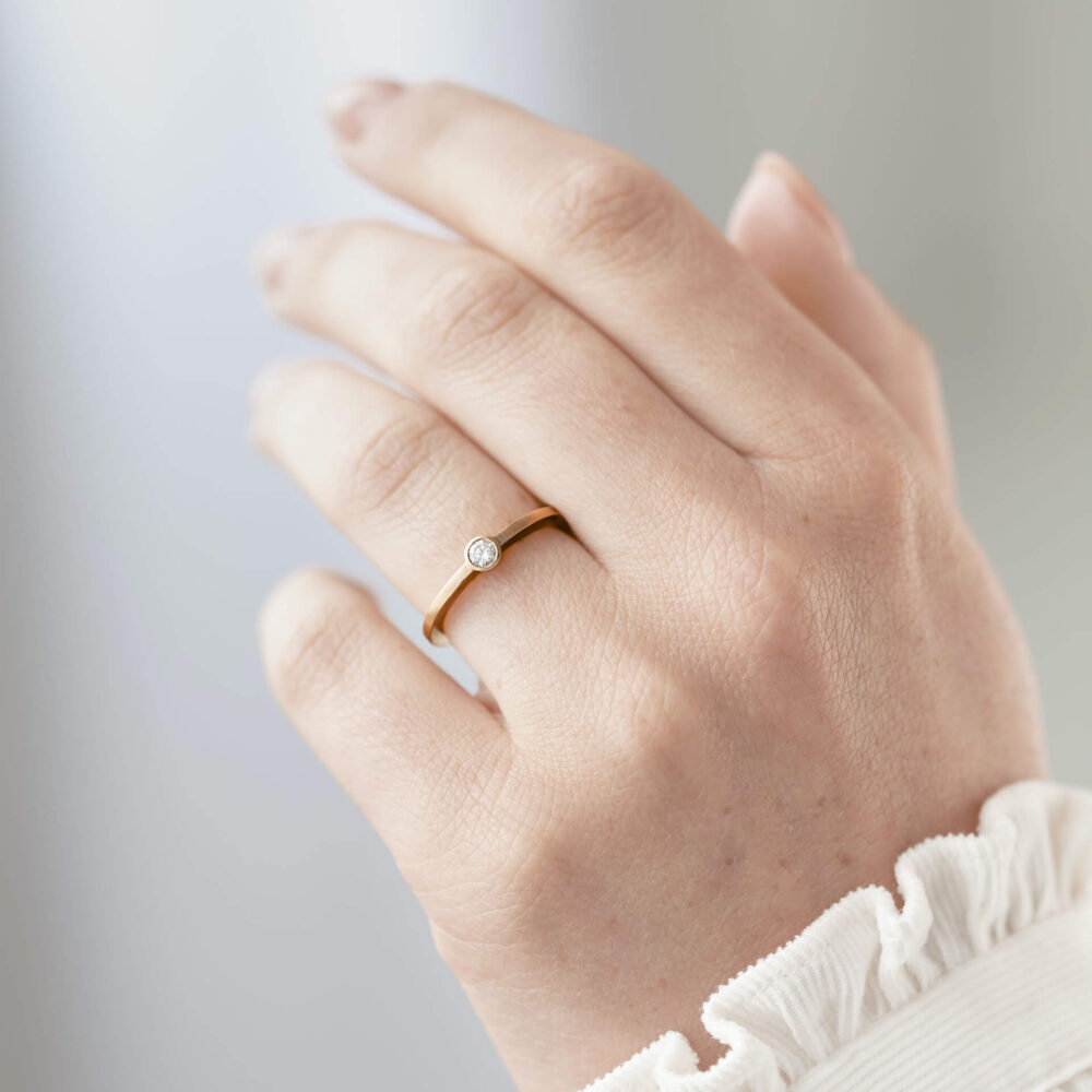 Thin Rose Gold Diamond Engagement Ring On Model. Designed By Jacks Turner In Her Bristol Jewellery Workshop.