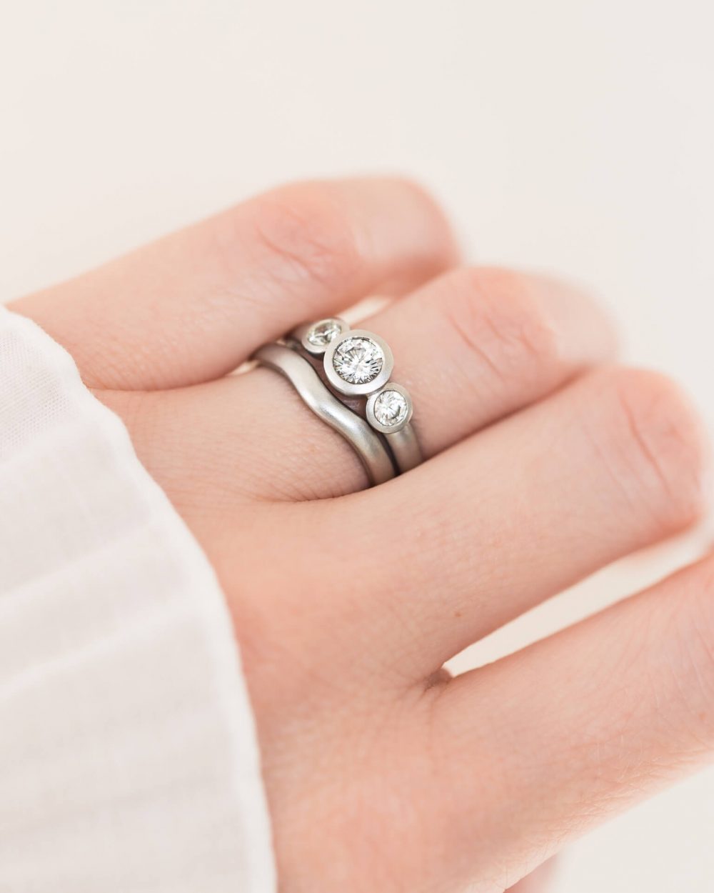 Grand Diamond Trilogy Ring With Curved Wedding Ring Jacks Turner Bristol