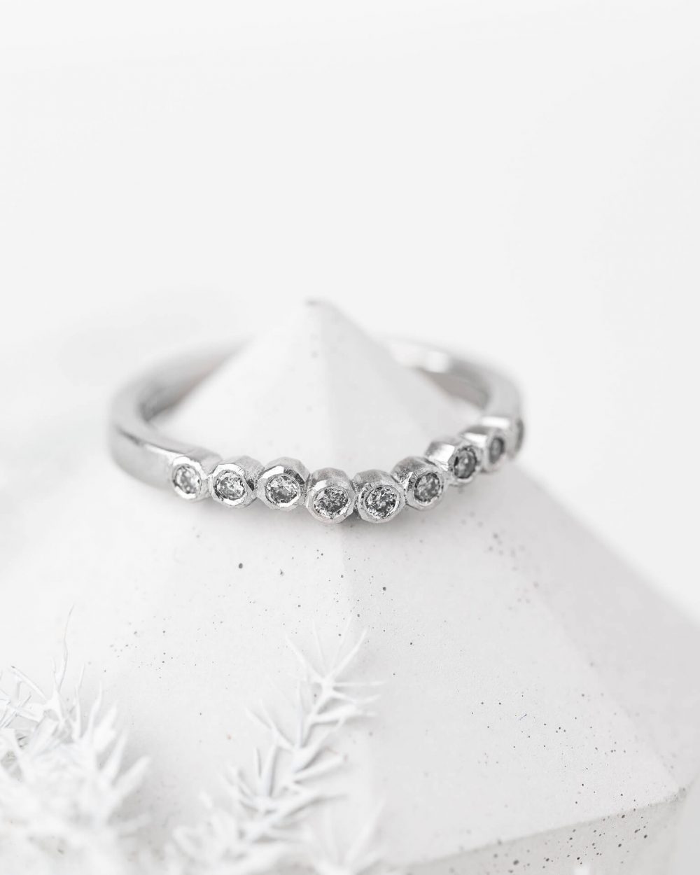 Geo Curved Salt And Pepper Diamond Ring, Handmade In Platinum. Pictured On A Cone By Bristol Jewellery Designer Jacks Turner.