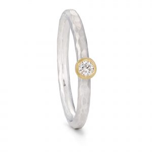 Silver textured diamond ring, with a yellow gold setting. Designed and handmade by Bristol jeweller Jacks Turner.