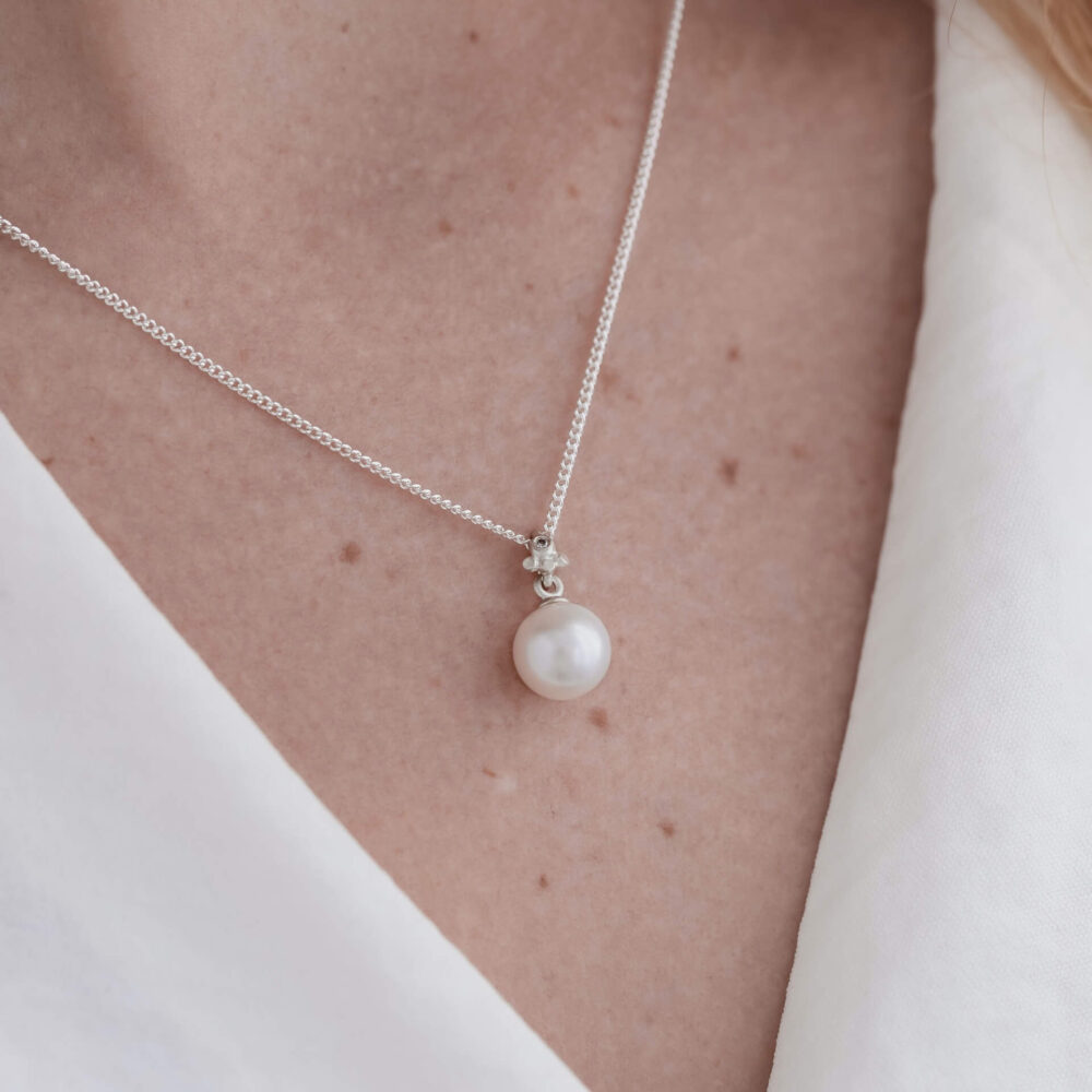 Bali White Pearl Drop Necklace On Model. Designed By Bristol Jeweller Jacks Turner.