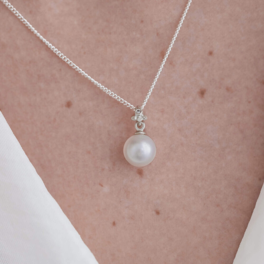 Bali White Pearl Drop Necklace On Model. Designed By Bristol Jeweller Jacks Turner.