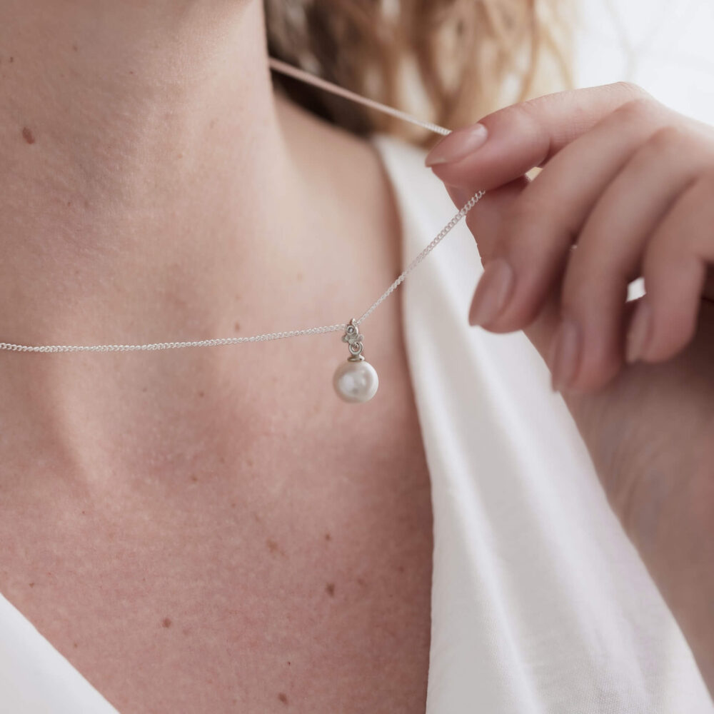 Bali White Pearl Drop Necklace On Model. Designed By Bristol Jeweller Jacks Turner.