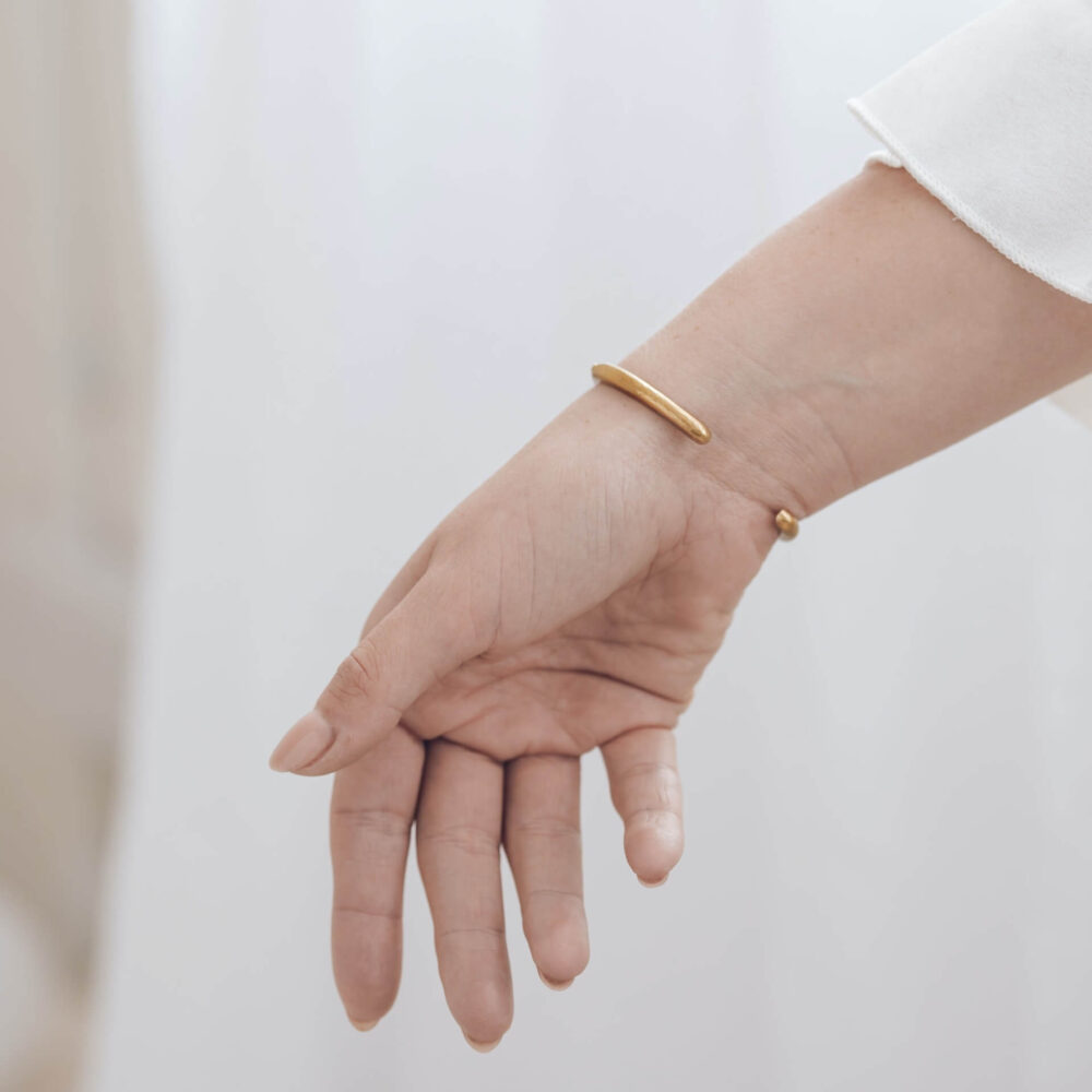 Huggie Ombre Diamond Gold Cuff Bracelet, Showing The Back View On Model. Designed By Bristol Contemporary Jeweller Jacks Turner.